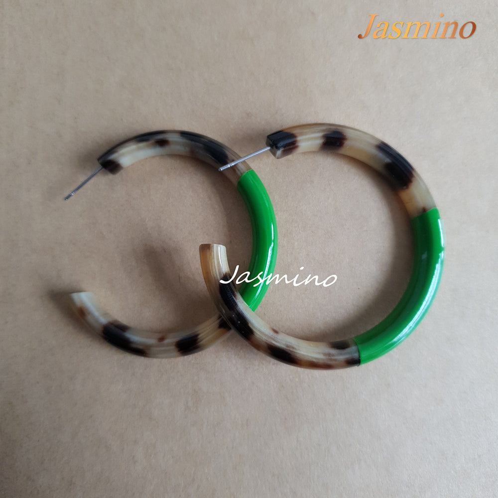 
                  
                    Minimalist C-shaped circle hoop earrings feature bright green and amber color for girls on Thanksgiving and Christmas
                  
                