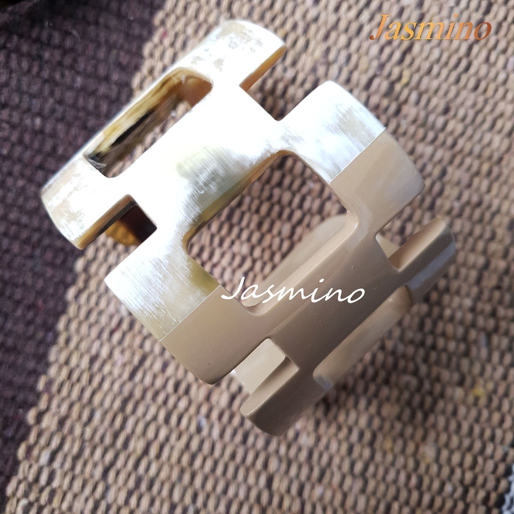 unique bracelet is designed with half natural buffalo horn and half painted taupe in natural light, an impressive gift for her