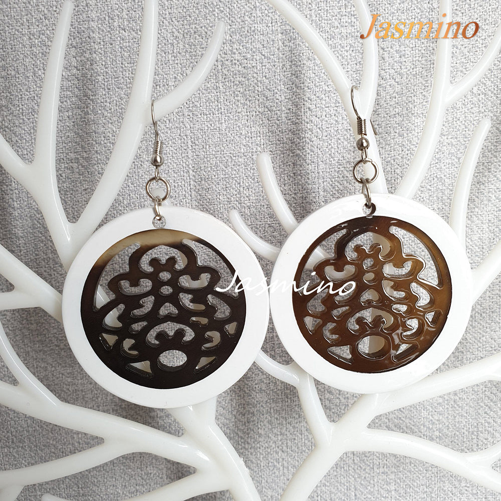 
                  
                    Beautiful unique floral circle dangle earrings feature white and brown in the natural light as Christmas gifts
                  
                