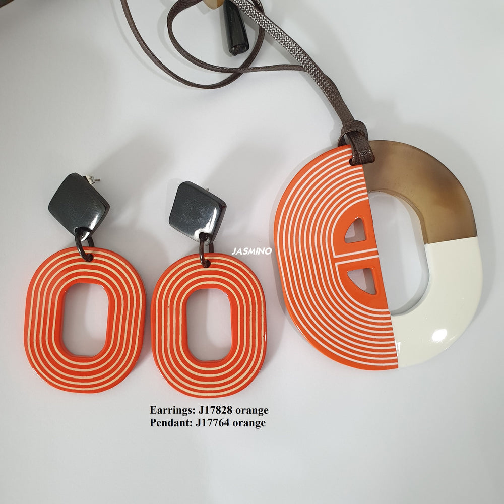 
                  
                    Jasmino sweet candy spiral oval earrings and necklace feature orange and white for Thanksgiving and Christmas gifts 
                  
                