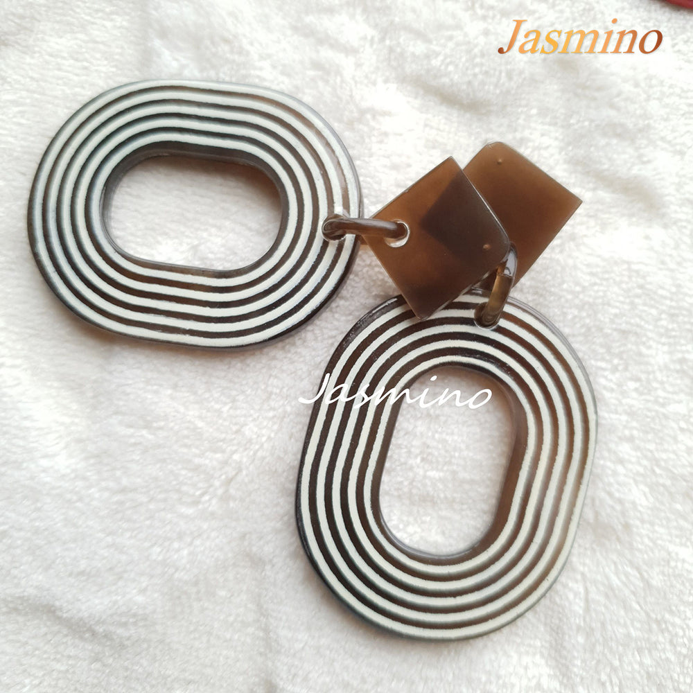 
                  
                    Jasmino sweet candy spiral oval earrings feature black and white for Thanksgiving and Christmas gifts 
                  
                