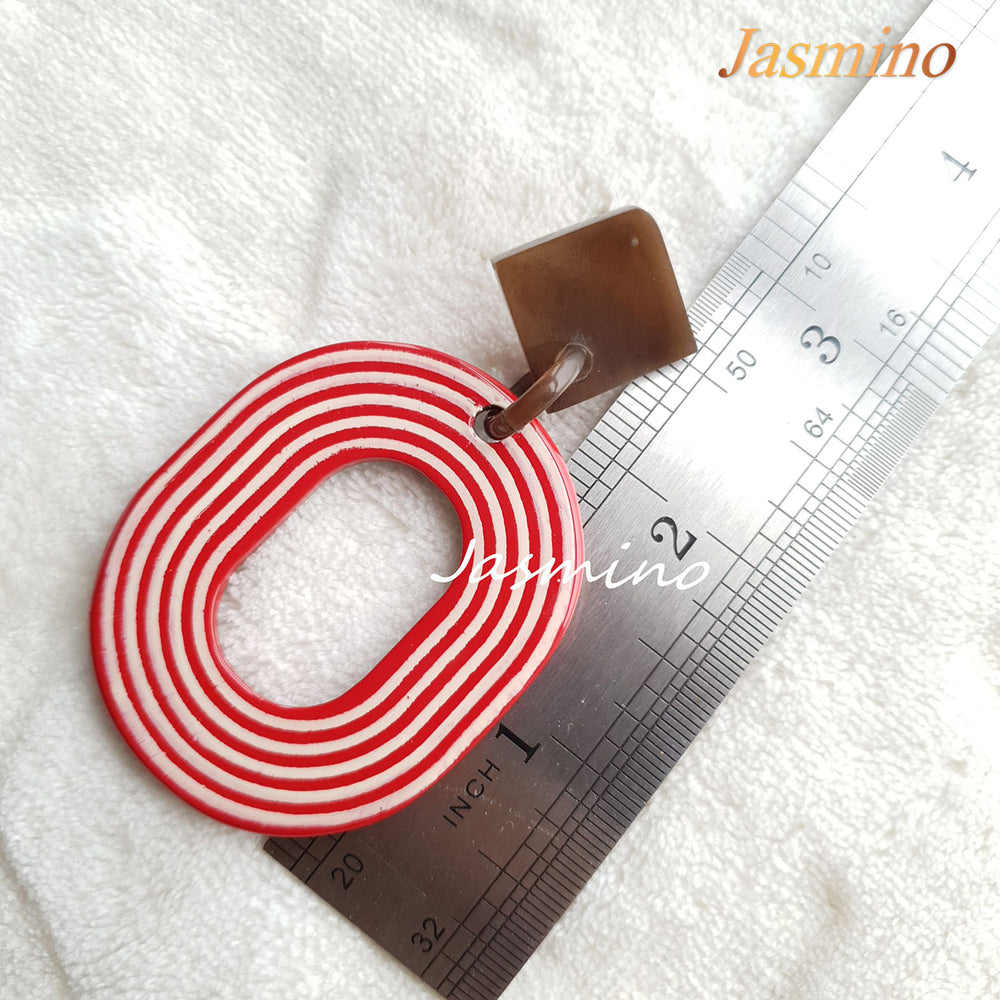 
                  
                    Jasmino sweet candy spiral oval earrings feature red and white for Thanksgiving and Christmas gifts 
                  
                