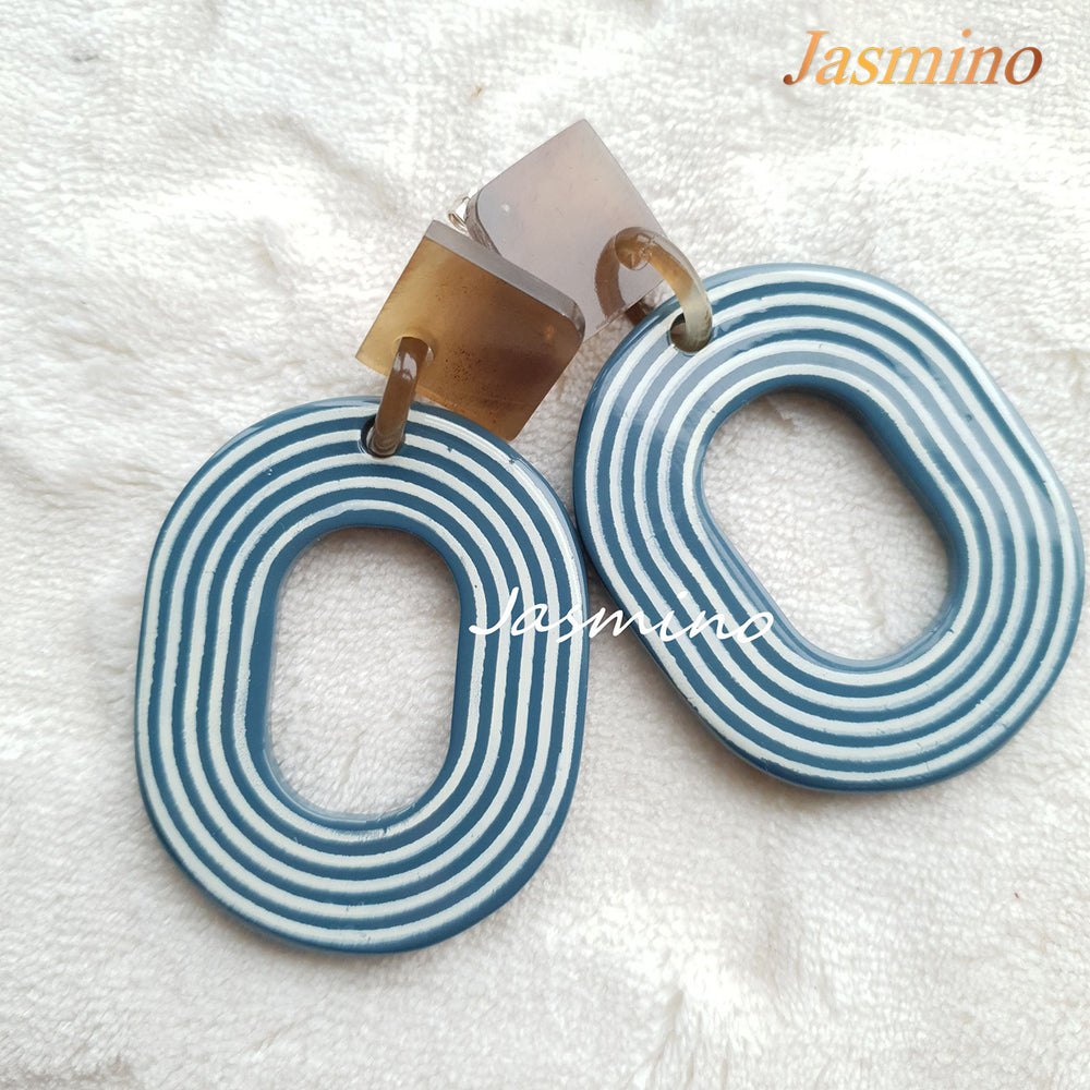 
                  
                    Jasmino sweet candy spiral oval earrings feature light blue and white for Thanksgiving and Christmas gifts 
                  
                