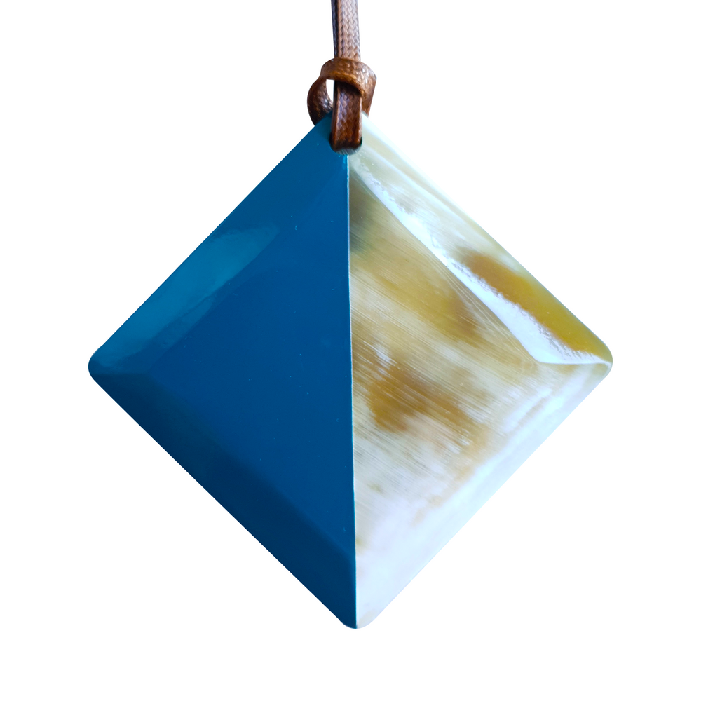 
                  
                    lozenge pendant with half natural horn and half painted classic blue on the light background, impressive gift for her
                  
                