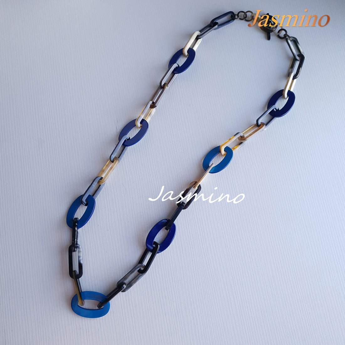 The necklace has several large sky blue and classic blue pieces in natural light, impressive gift for her