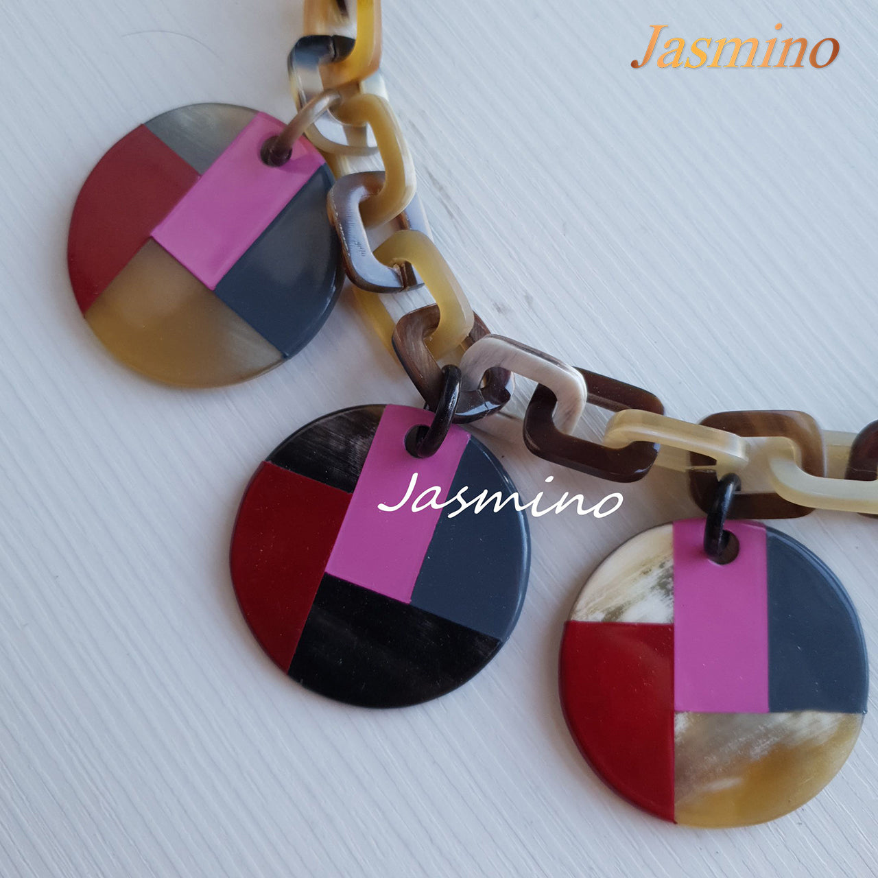 unique circle pink lacquer necklace on the light background, impressive gift for her