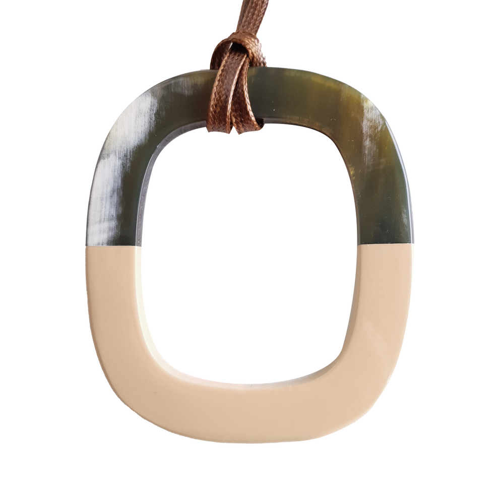 
                  
                    pendant is designed with the top half of a natural buffalo horn and the bottom half is painted beige, unique gift for her
                  
                