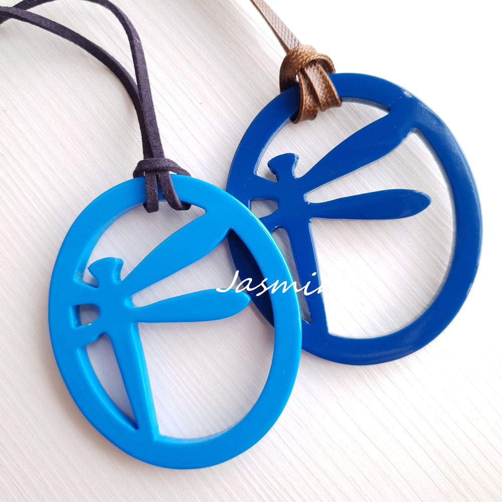 
                  
                    elliptical spring break pendants with dragonfly pattern inside on the light background, impressive gift for her, featured blue and turquoise
                  
                