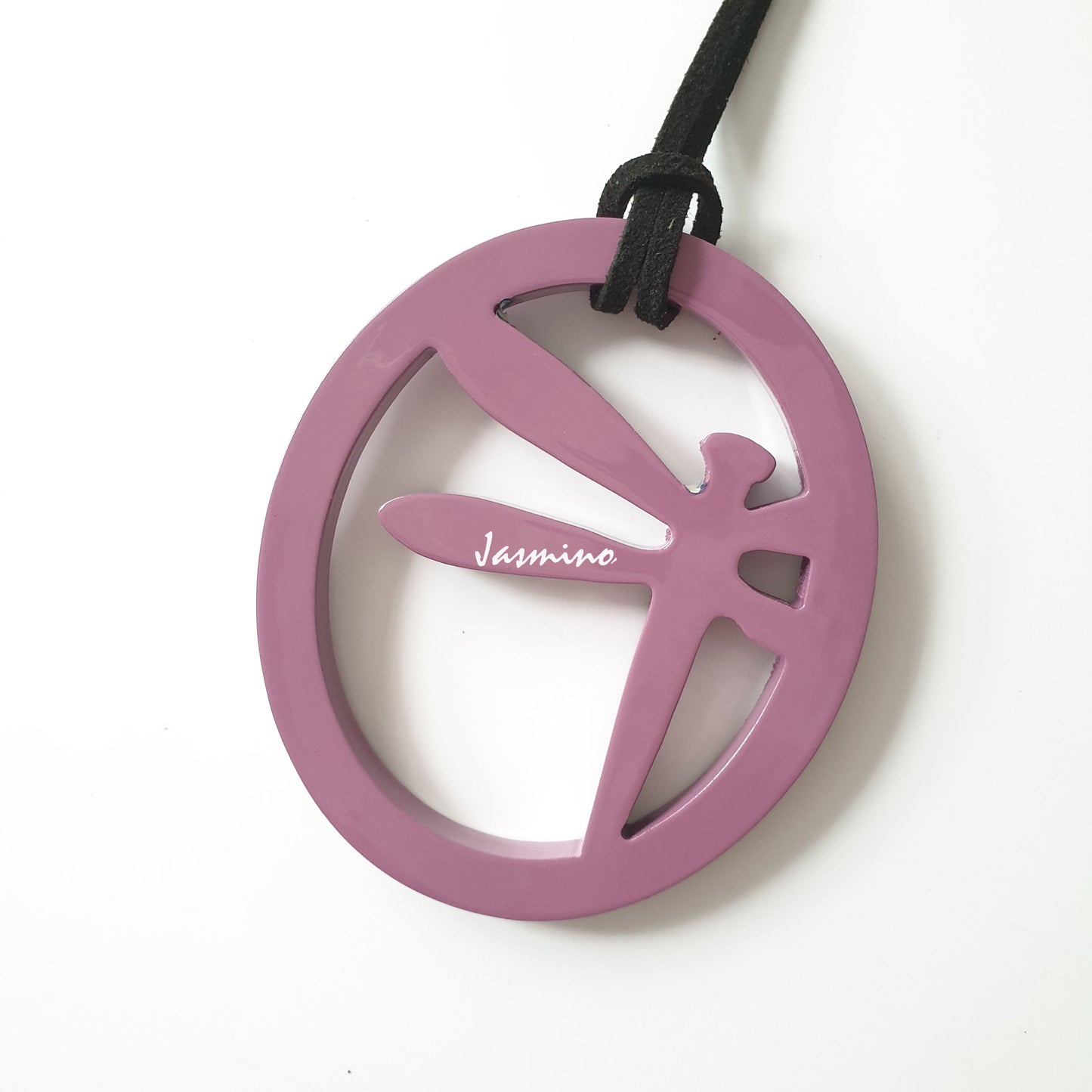 elliptical purple pendant with dragonfly pattern inside on the light background, impressive gift for her