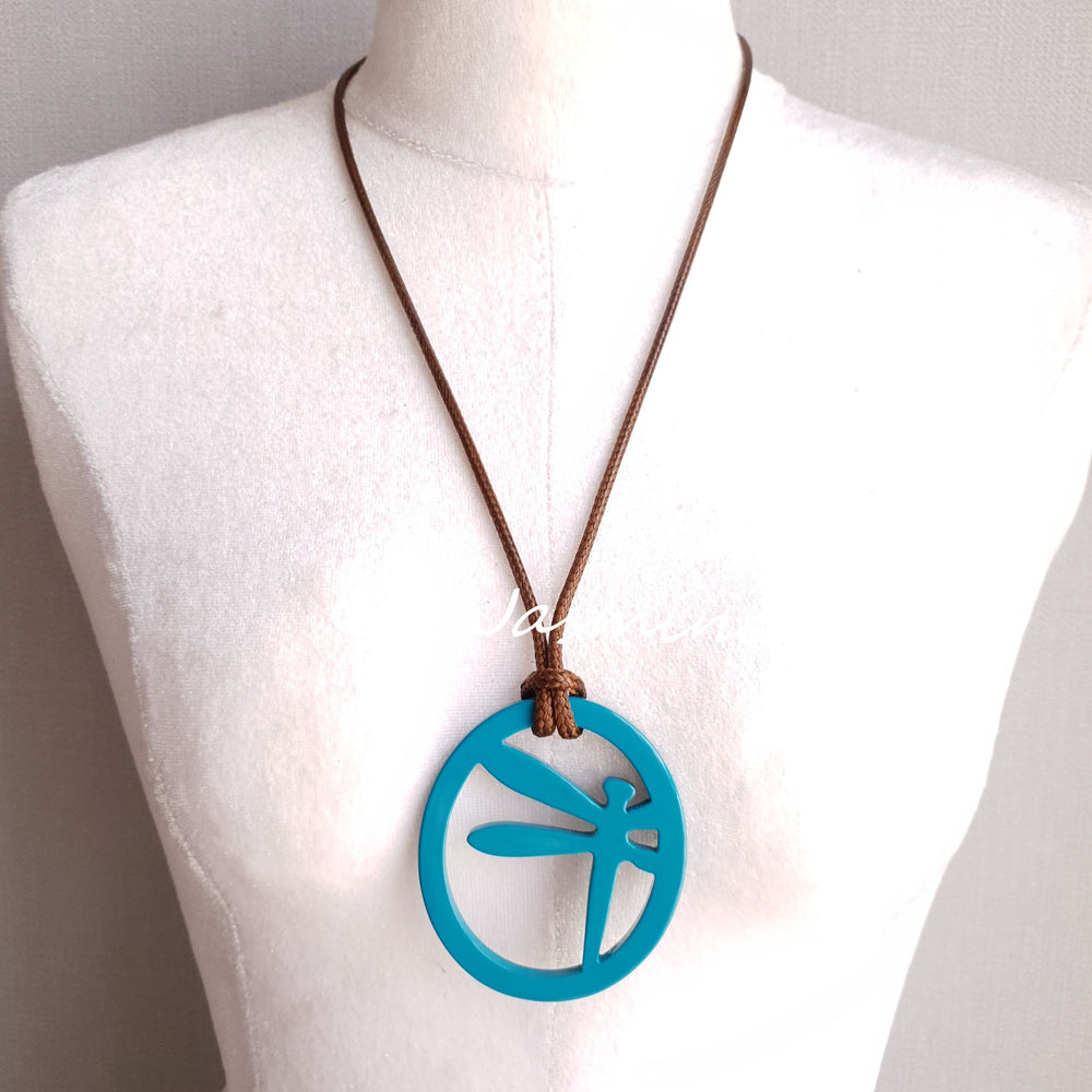 
                  
                    elliptical spring break pendant with dragonfly pattern inside on the light background, impressive gift for her. featured turquoise
                  
                