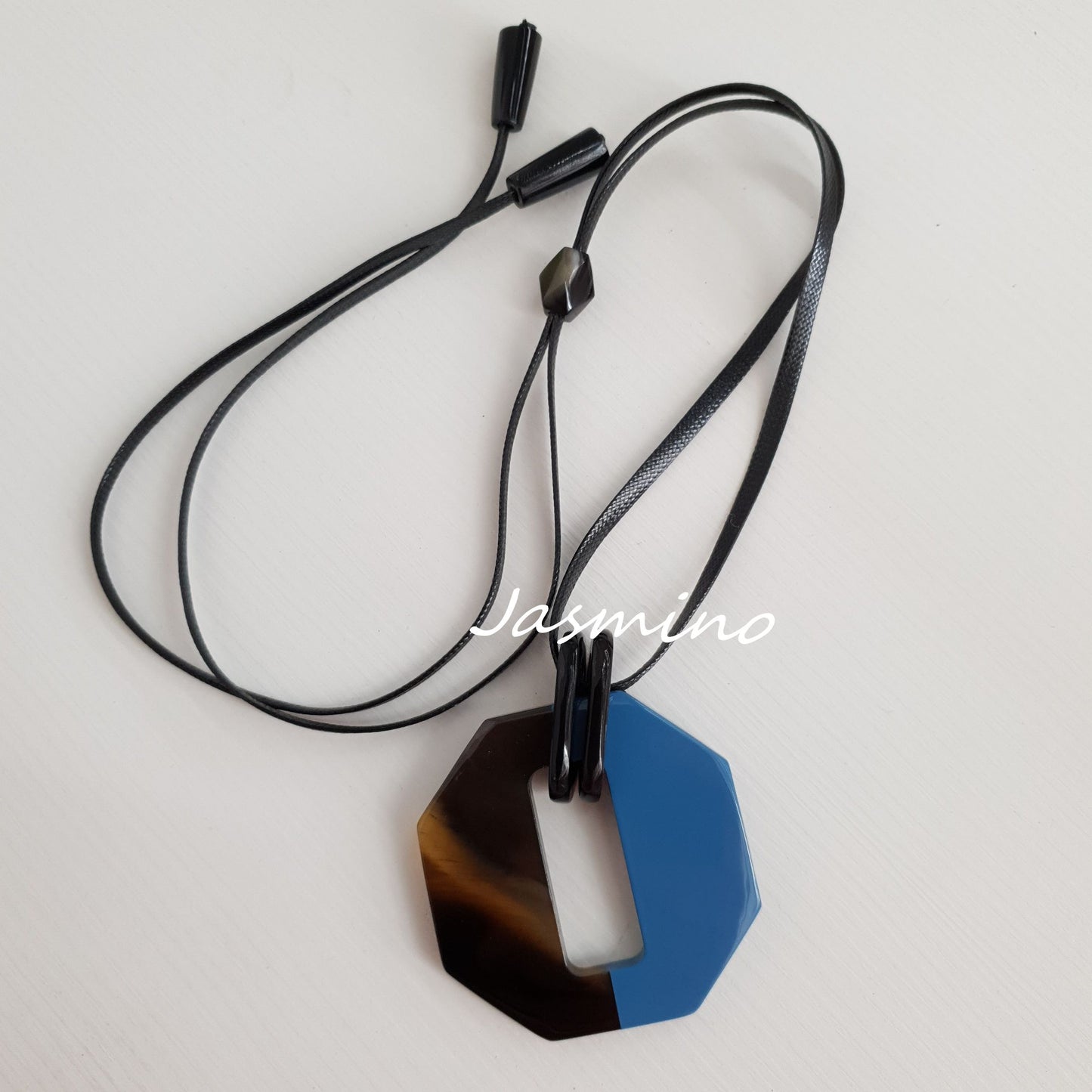 The pendant is designed with half natural horn and half octagon blue lacquer, impressive gift for her