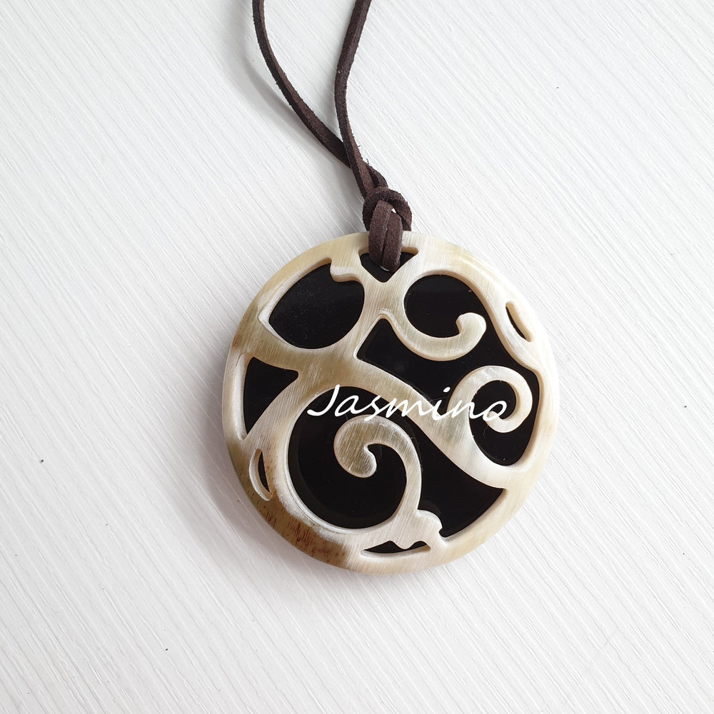 
                  
                    natural horn pendant on the light background, impressive gift for her
                  
                