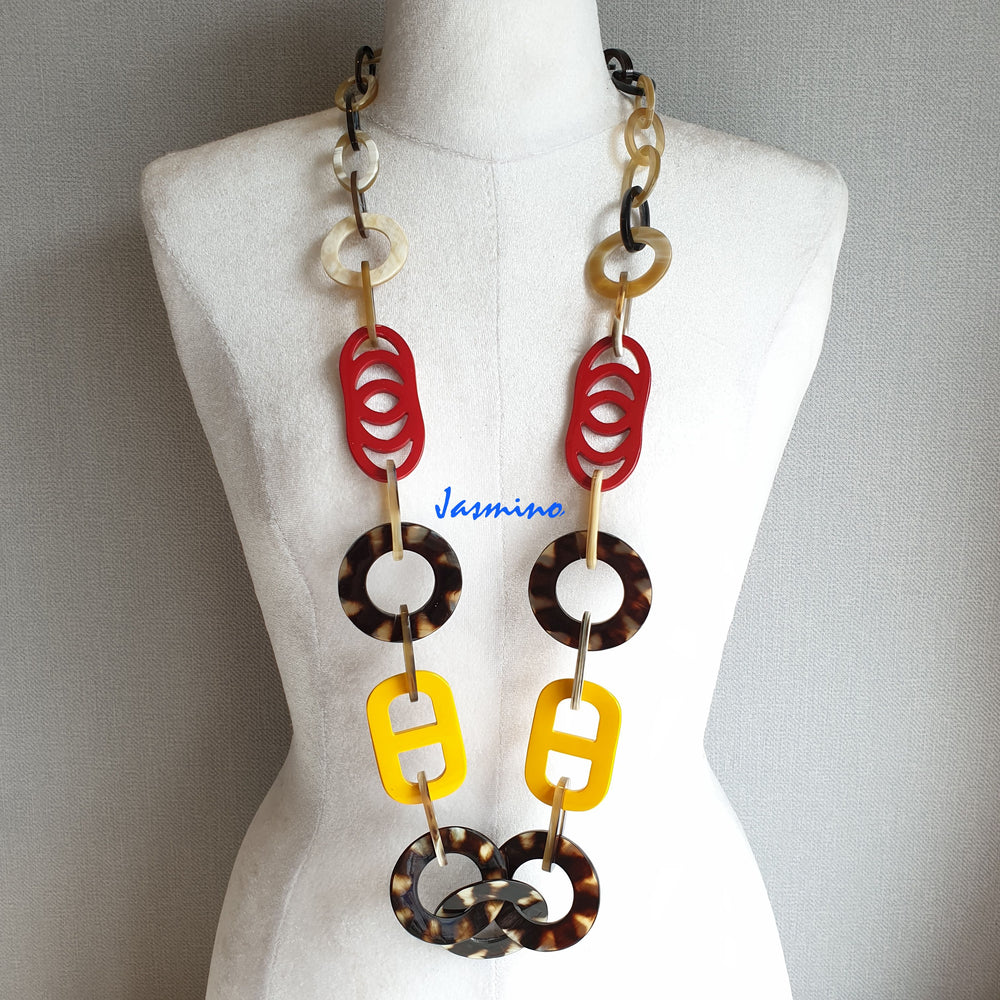 
                  
                    The necklace has several large flame scarlet and vibrant yellow pieces in natural light, impressive gift for her
                  
                