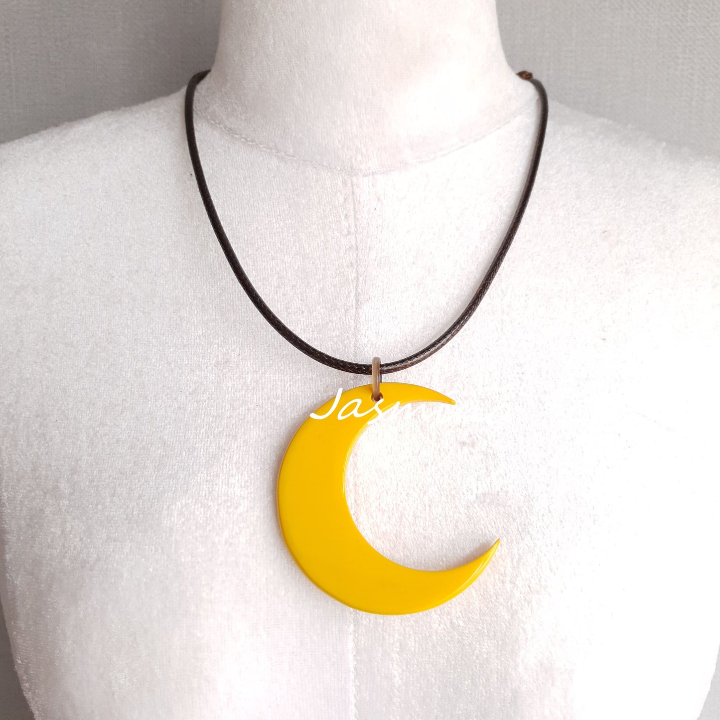 yellow moon shaped pendant on the light background, impressive gift for her