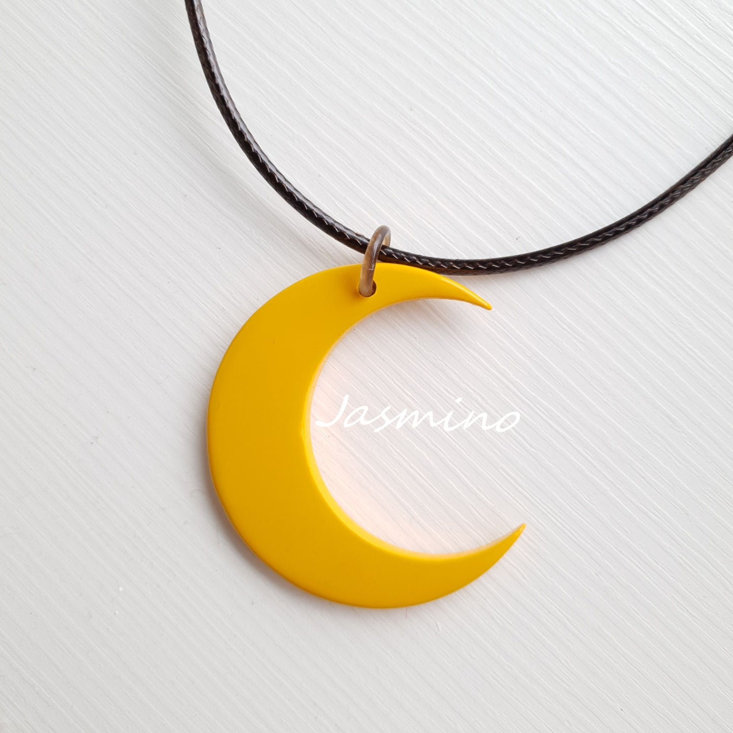 yellow moon shaped pendant on the light background, impressive gift for her