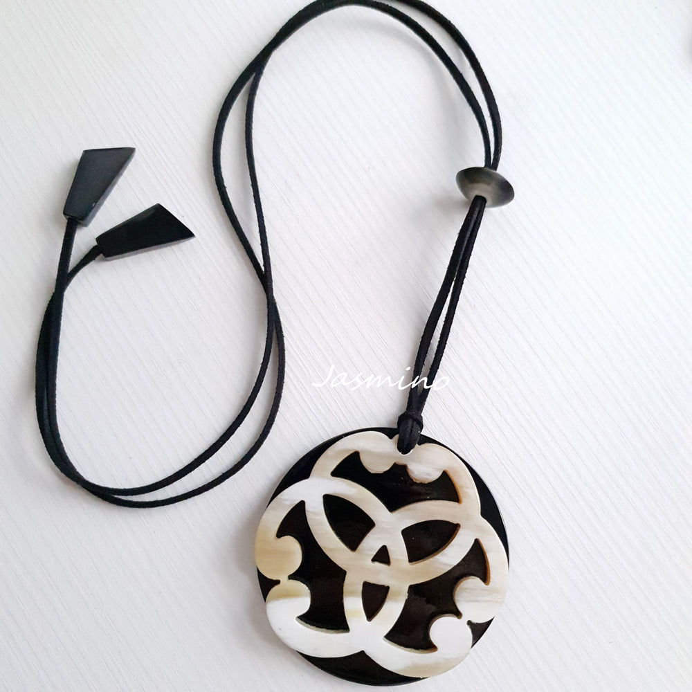 
                  
                    natural circle horn pendant on the light background, impressive gift for her
                  
                