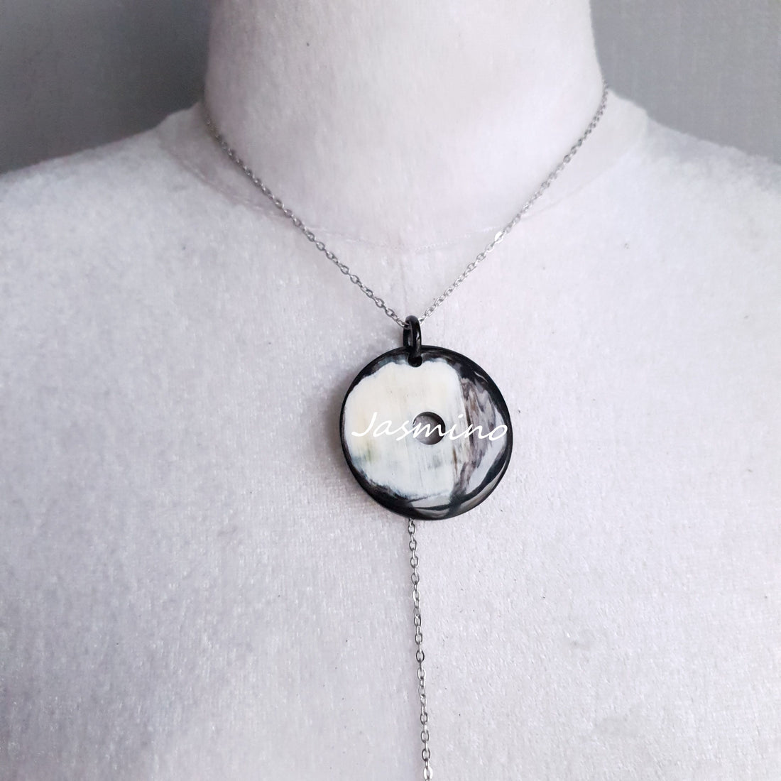 <img src="buffalo horn necklace.jpg" alt="This necklace has a circle pendant in natural light, unique gift for her">