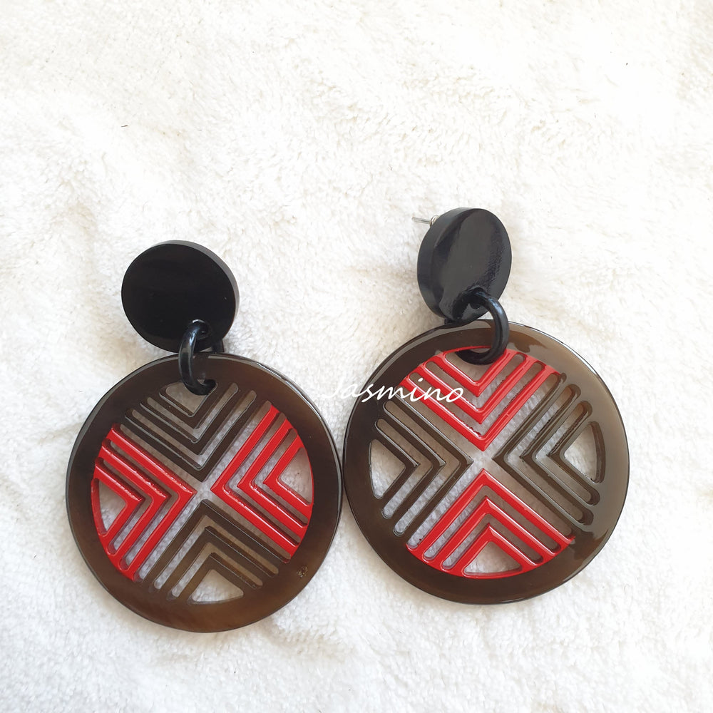 
                  
                    Ethnic Chic circle drop earrings feature brown and red color in the natural light
                  
                