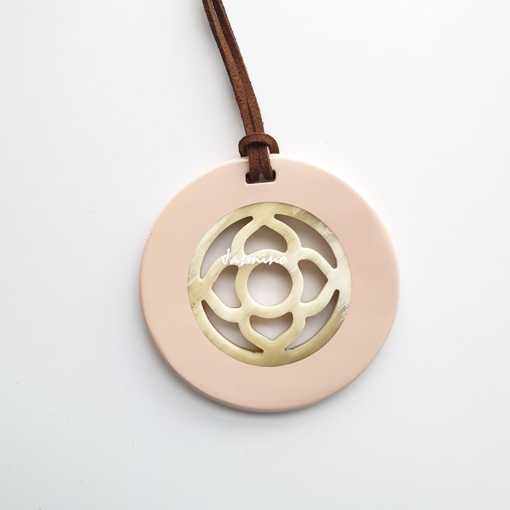 
                  
                    <img src = "buffalo horn pendant.jpg" alt = "round pendant with rose quartz outside, inside with flower pattern made from natural buffalo horn on a light background, an impressive gift for her">
                  
                
