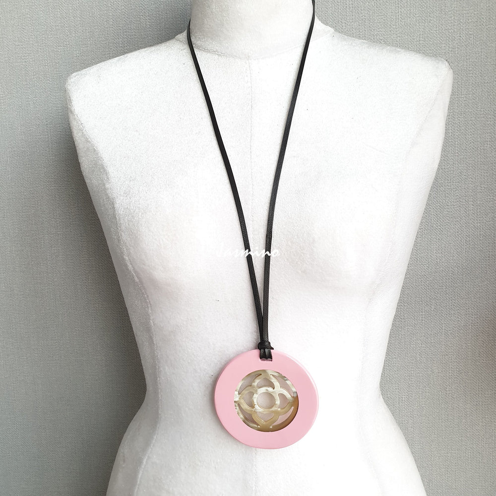 
                  
                    <img src = "buffalo horn pendant.jpg" alt = "round pendant with light pink outside, inside with flower pattern made from natural buffalo horn on a light background, an impressive gift for her">
                  
                