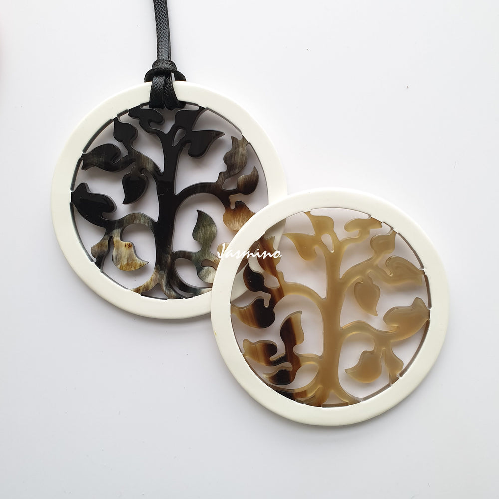 
                  
                    round pendant is designed with brilliant white outline, inside with a tree pattern made of unique natural buffalo horn on a light background- 8cm, jasmino.vn
                  
                