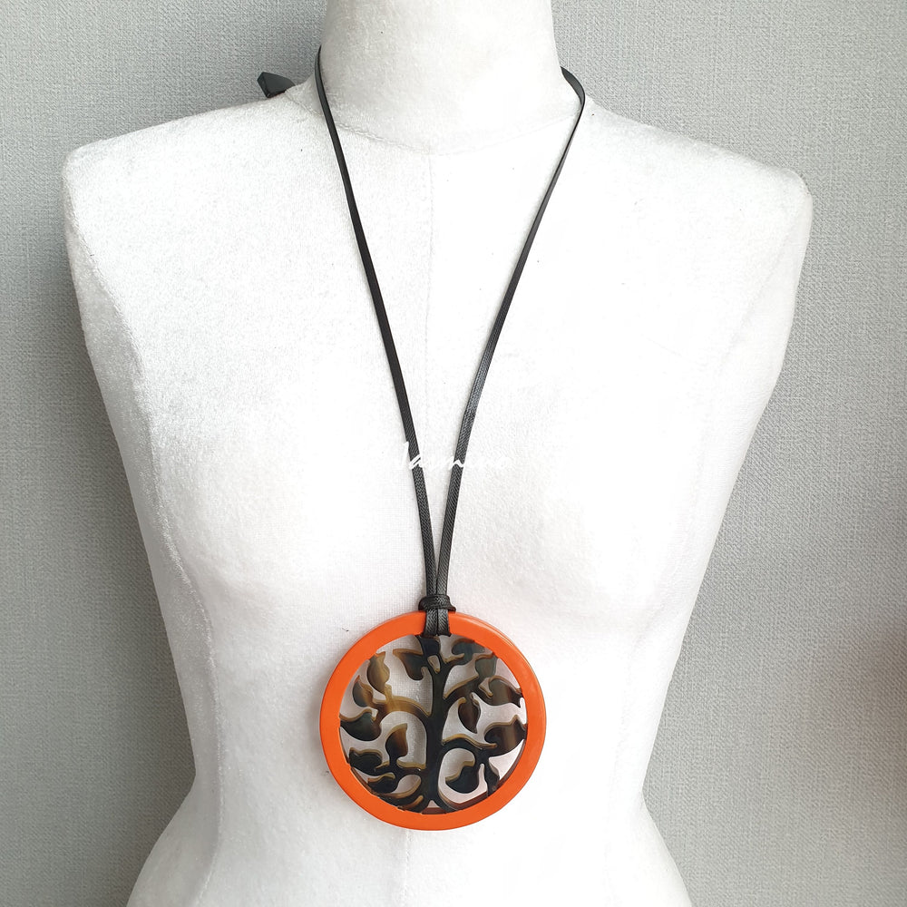 
                  
                    round pendant is designed with orange peel outline, inside with a tree pattern made of unique natural buffalo horn on a light background- 8cm, jasmino.vn
                  
                