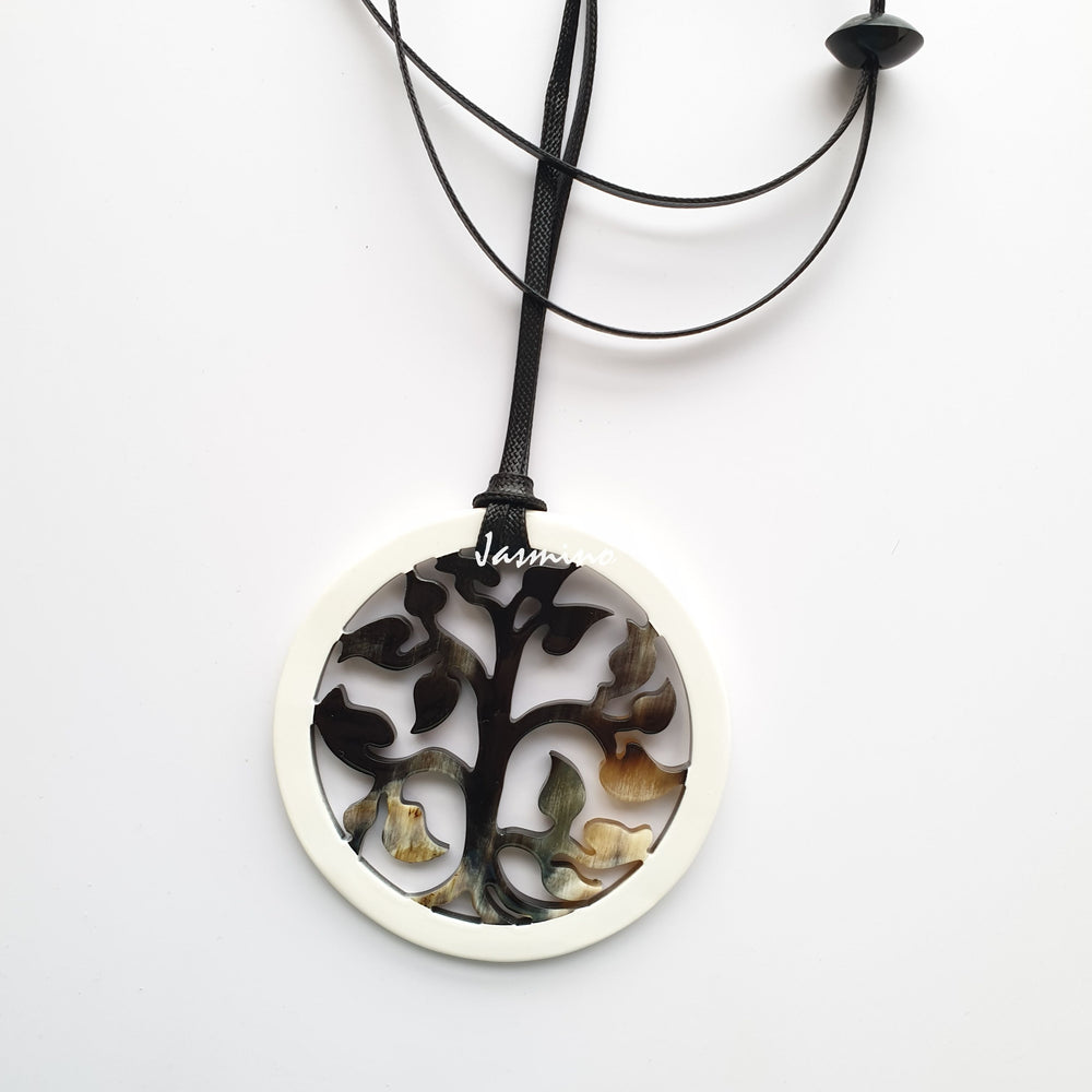 
                  
                    round pendant is designed with brilliant white outline, inside with a tree pattern made of unique natural buffalo horn on a light background- 8cm, jasmino.vn
                  
                