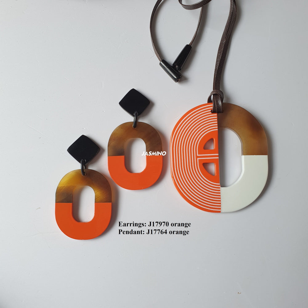 
                  
                    A set of handmade oval earrings and a pendant necklace is made by natural buffalo horn with burnt orange color for girls
                  
                