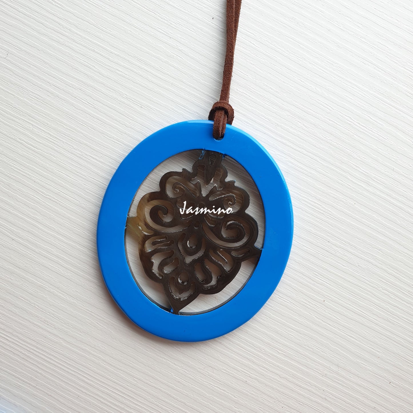 elliptical sky blue horn pendant with unique pattern on the light background, impressive gift for her