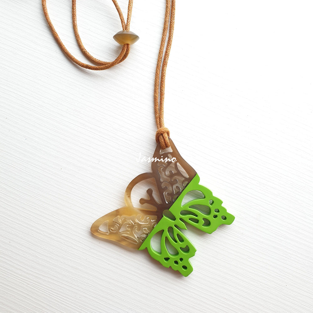 
                  
                    butterfly pendant is designed with natural buffalo horn on top and lime horn on bottom, jasmino.vn, a unique gift for her
                  
                