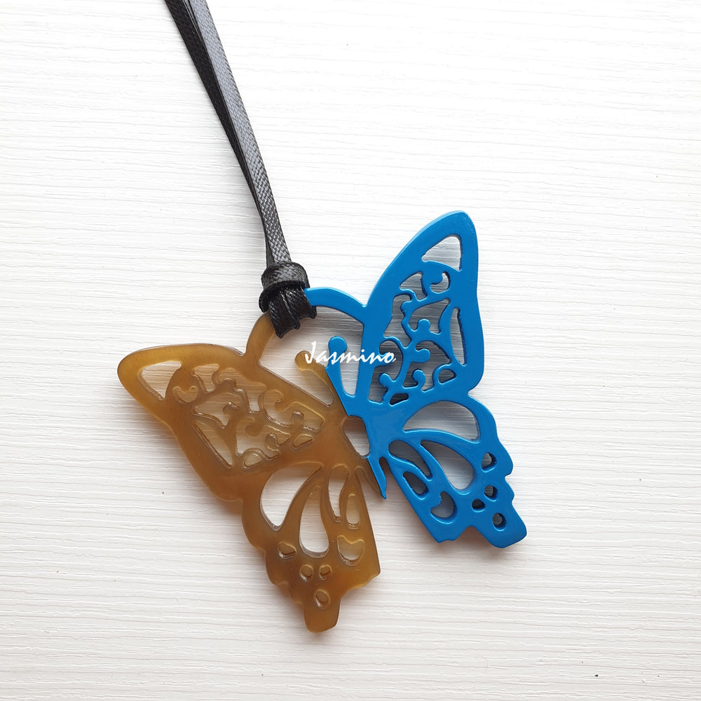 
                  
                    butterfly pendant is designed with half natural horn and half painted azure blue on the light background, impressive gift for her
                  
                