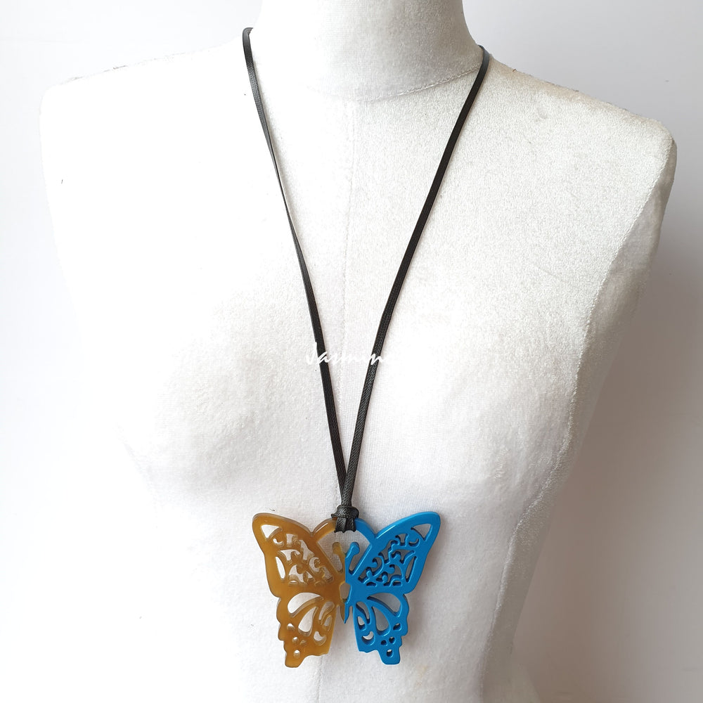 
                  
                    butterfly pendant is designed with half natural horn and half painted azure blue on the light background, impressive gift for her
                  
                