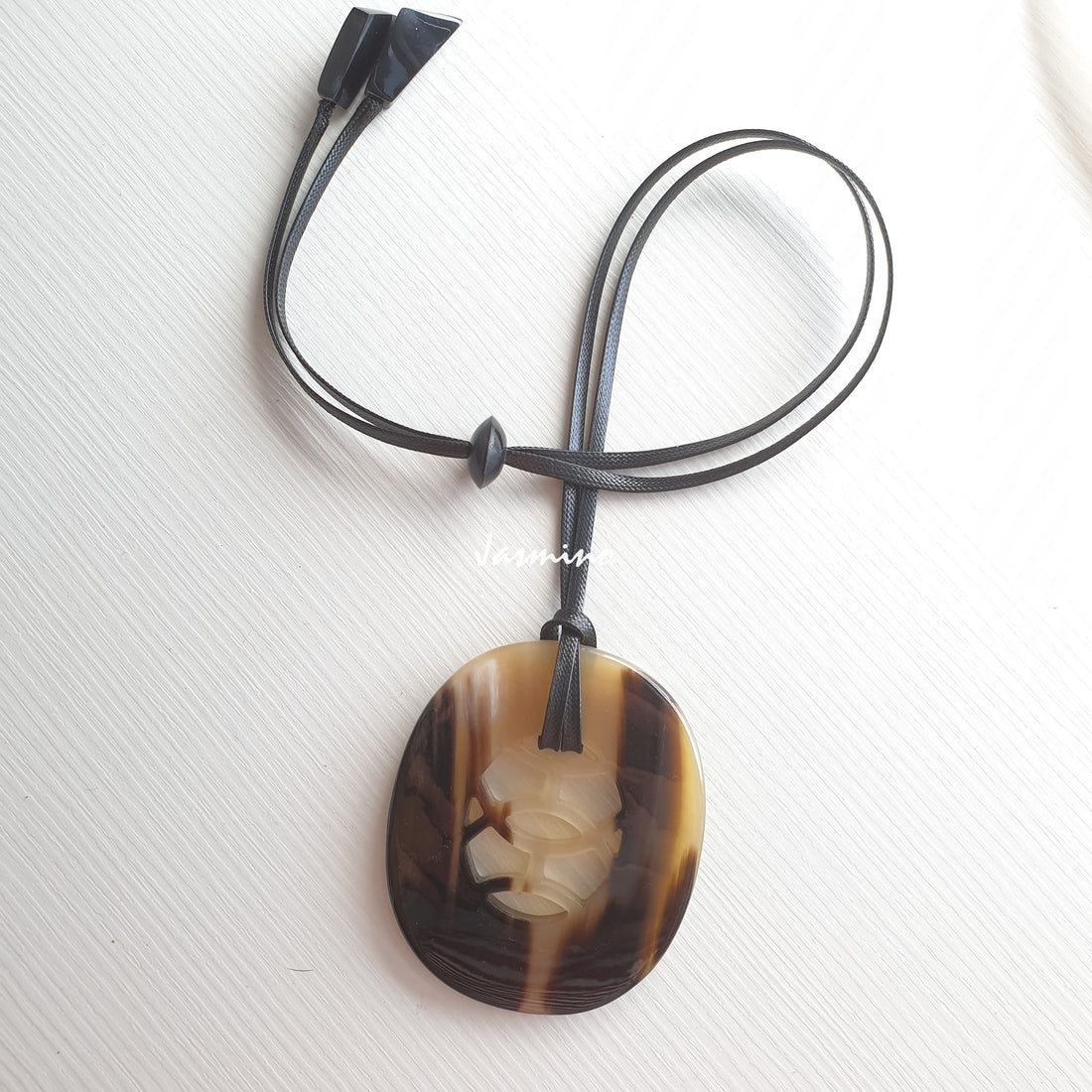 natural horn pendant with unique pattern on the light background, impressive gift for her