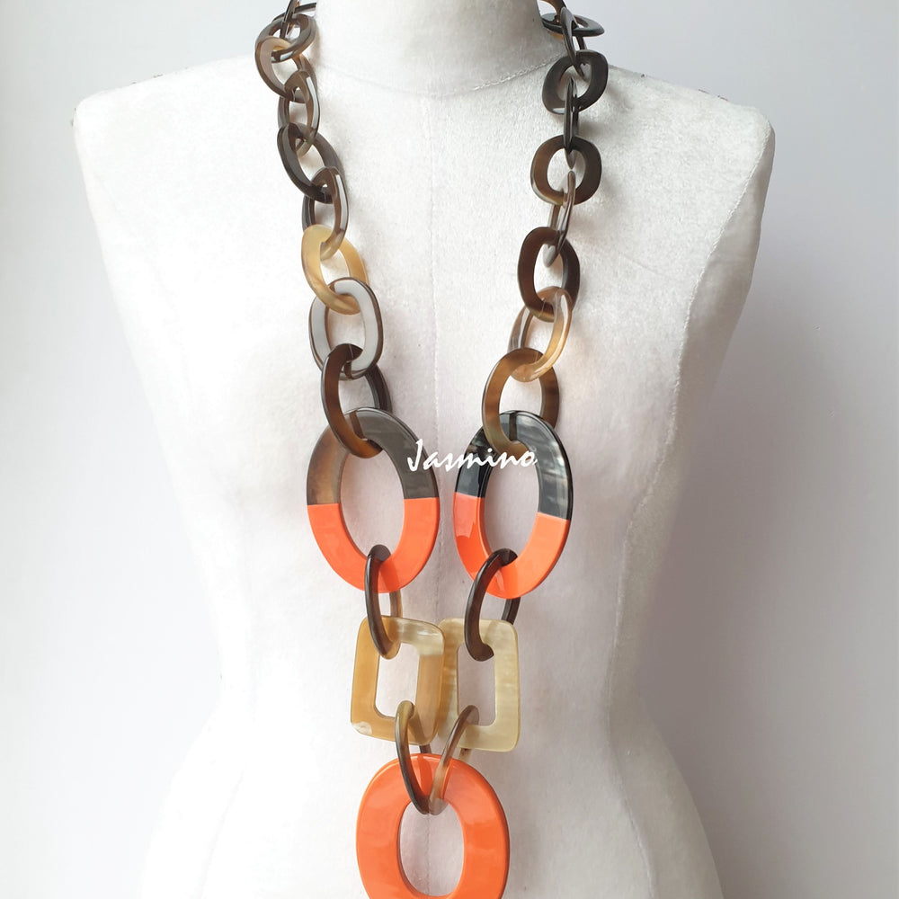 
                  
                    unique handmade Bohemian large chain link necklace accessory features brow and orange in natural buffalo horn
                  
                