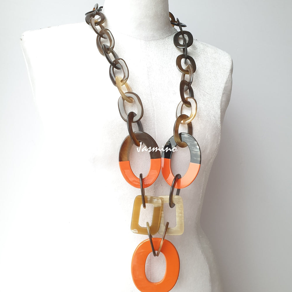
                  
                    unique handmade Bohemian large chain link necklace accessory features brow and orange in natural buffalo horn
                  
                