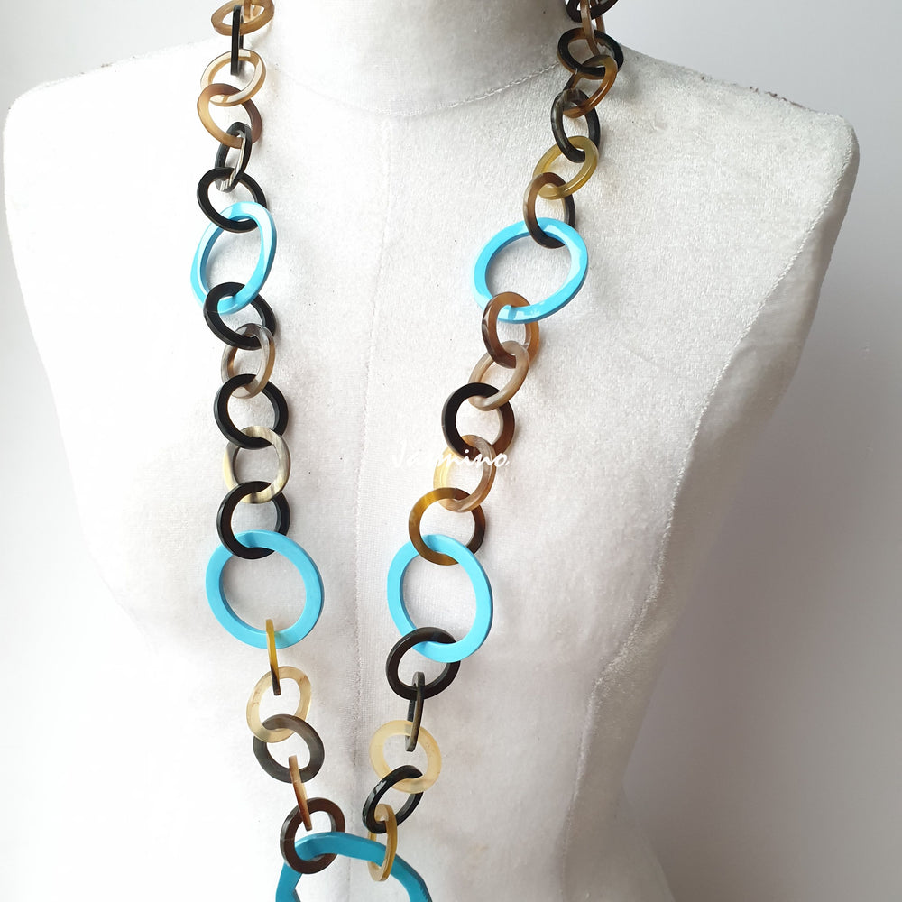 
                  
                    The necklace has some large aqua links on the light background, a unique gift for her
                  
                