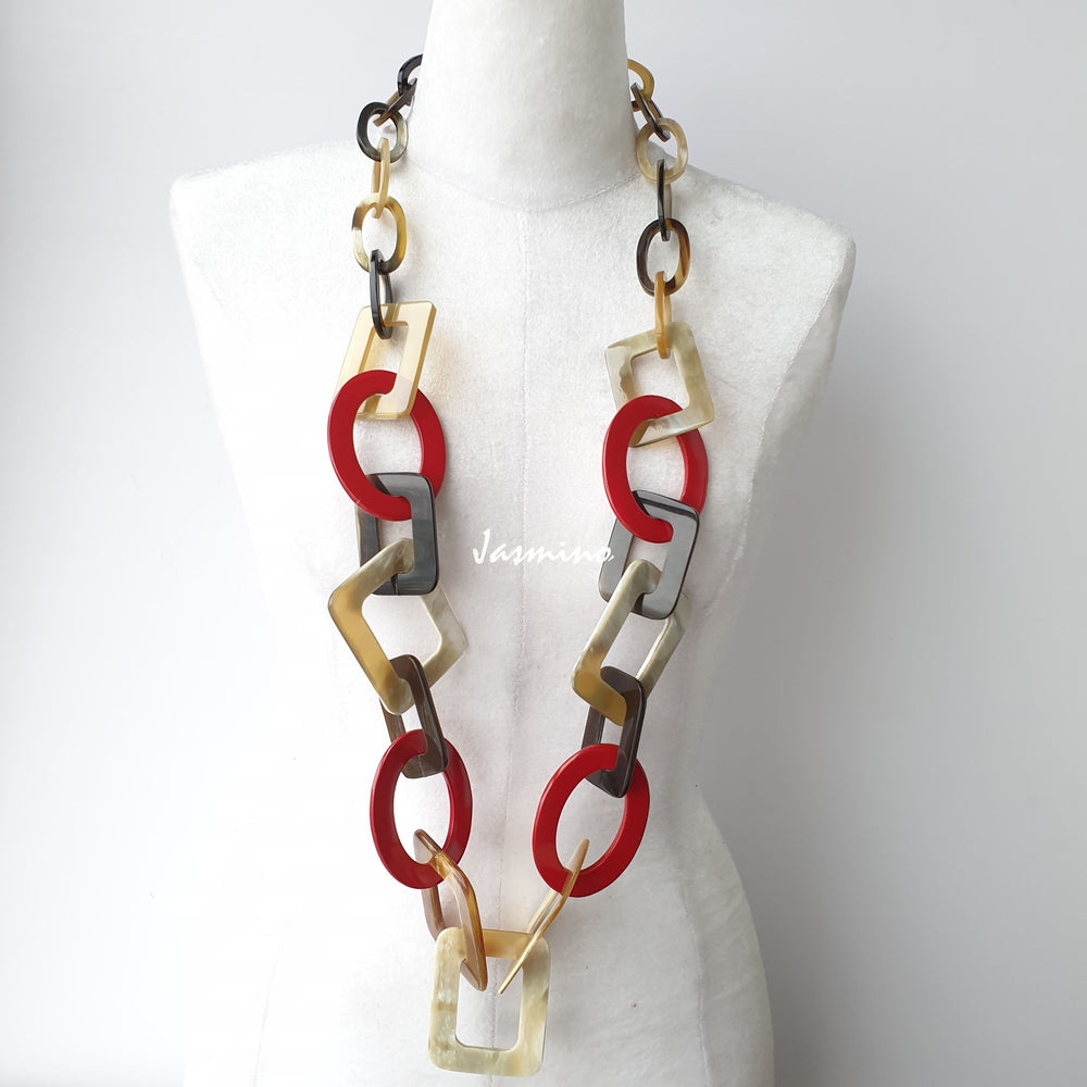 The necklace has several power red pieces in natural light, impressive gift for her