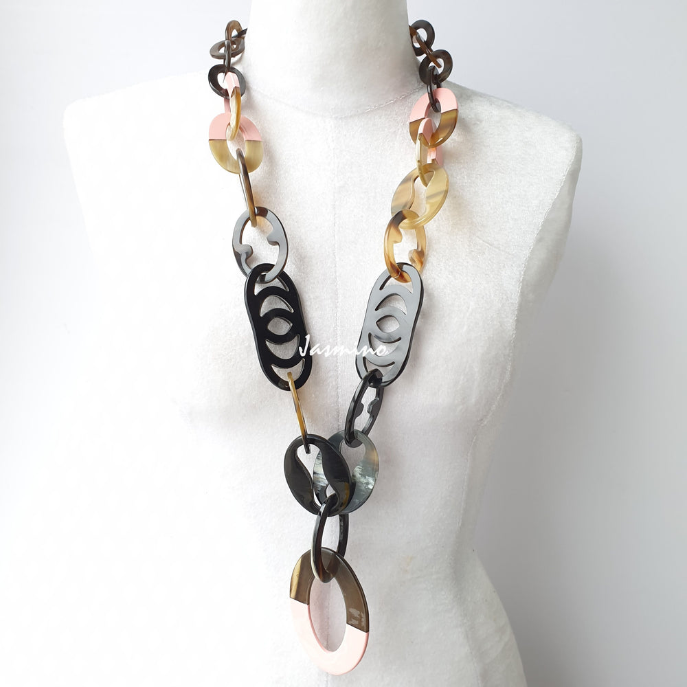 
                  
                    The necklace has pieces with half natural horn and half coral pink lacquer, unique gift for her
                  
                
