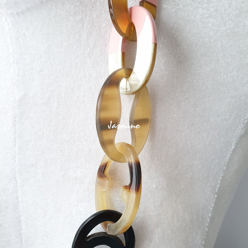 
                  
                    The necklace has pieces with half natural horn and half coral pink lacquer, unique gift for her
                  
                