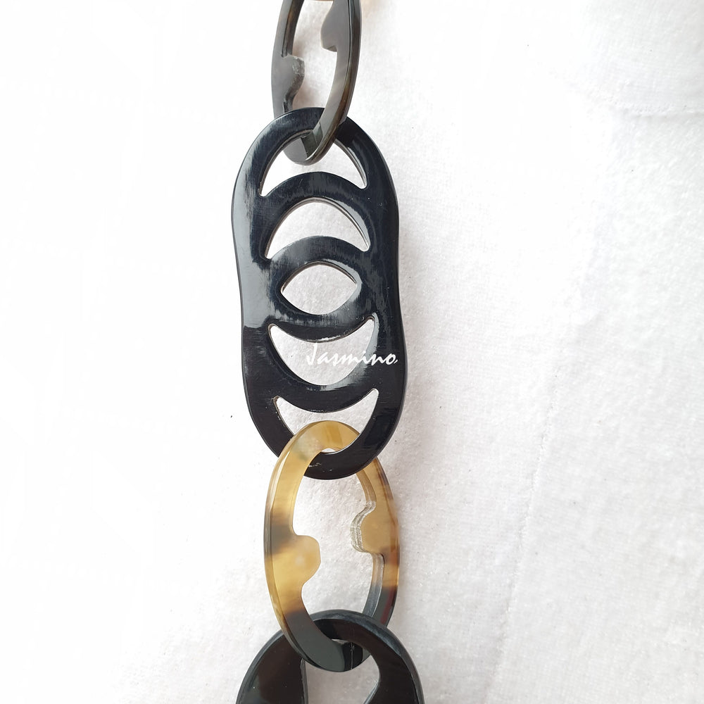 
                  
                    The necklace has pieces with half natural horn and half coral pink lacquer, unique gift for her
                  
                