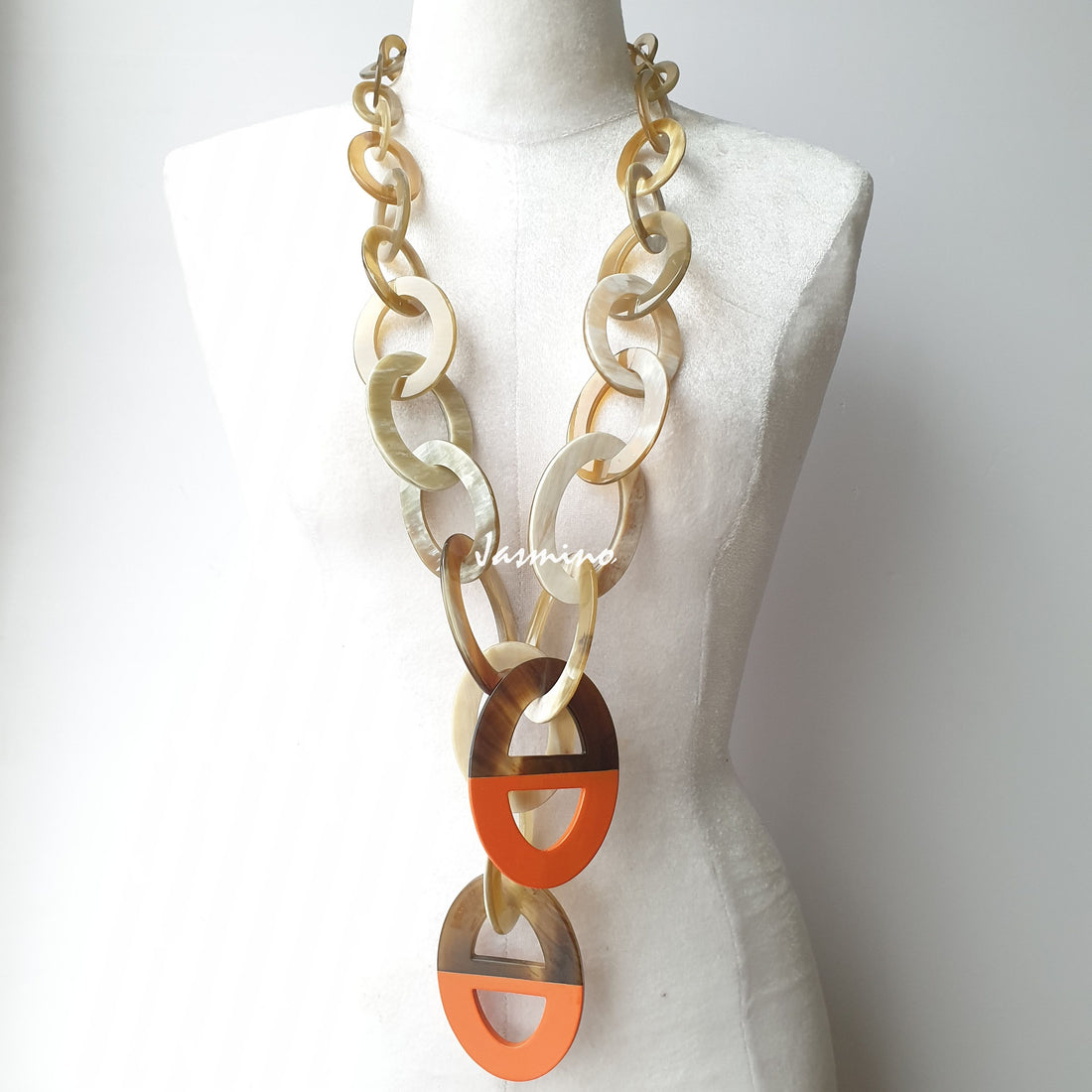 unique handmade large chain link necklace accessory features white circles and D-shaped orange ovals in natural buffalo horn