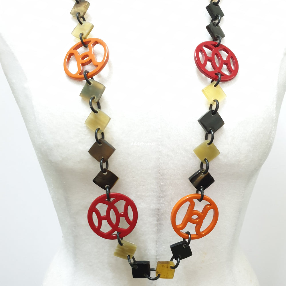 
                  
                    unique handmade Bohemian Ethnic diamond shaped chain link accessory is detailed by dark colours and bright circles in natural buffalo horn for festivals
                  
                