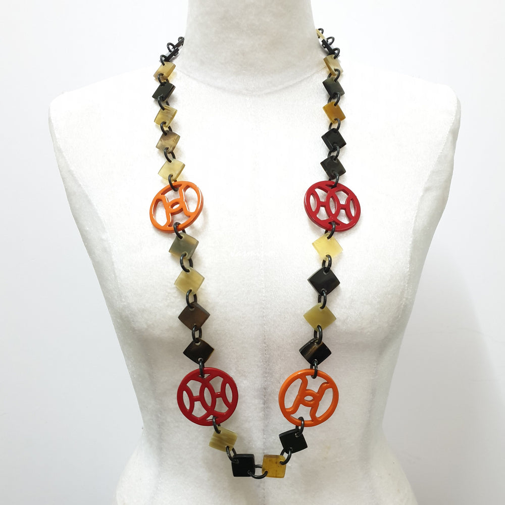 
                  
                    unique handmade Bohemian Ethnic diamond shaped chain link accessory is detailed by dark colours and bright circles in natural buffalo horn for festivals
                  
                