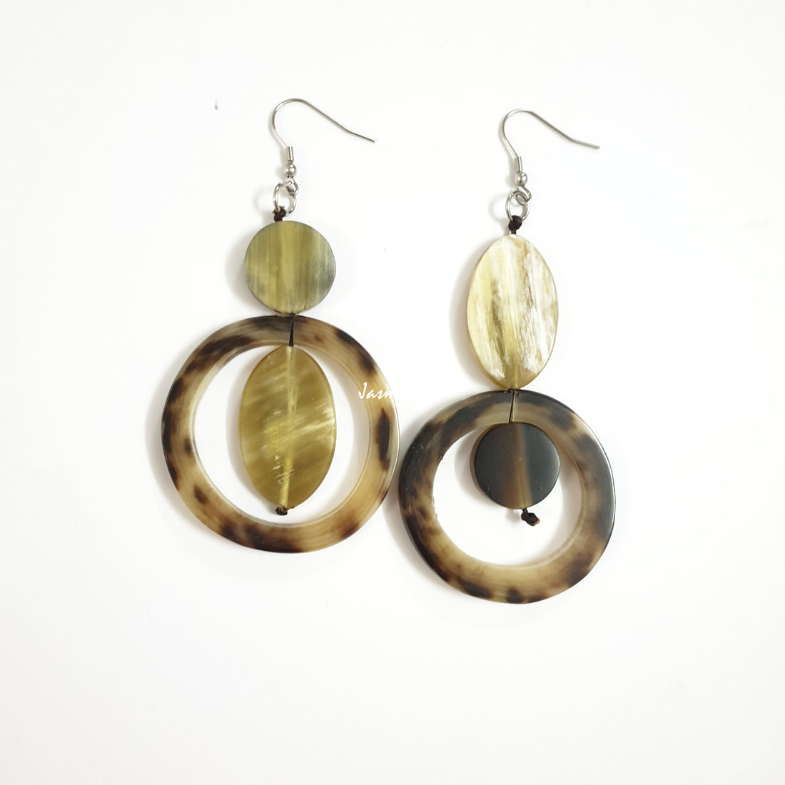 Handmade circular dangle earrings are made by natural buffalo horn featured green tea and brown color in the natural light