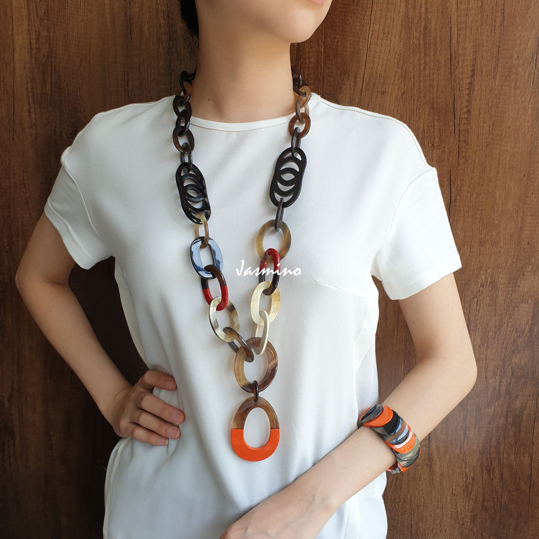 A model is wearing unique handmade Bohemian Ethic chain link necklace and bracelet accessory with different colours in natural buffalo horn on Thanksgiving