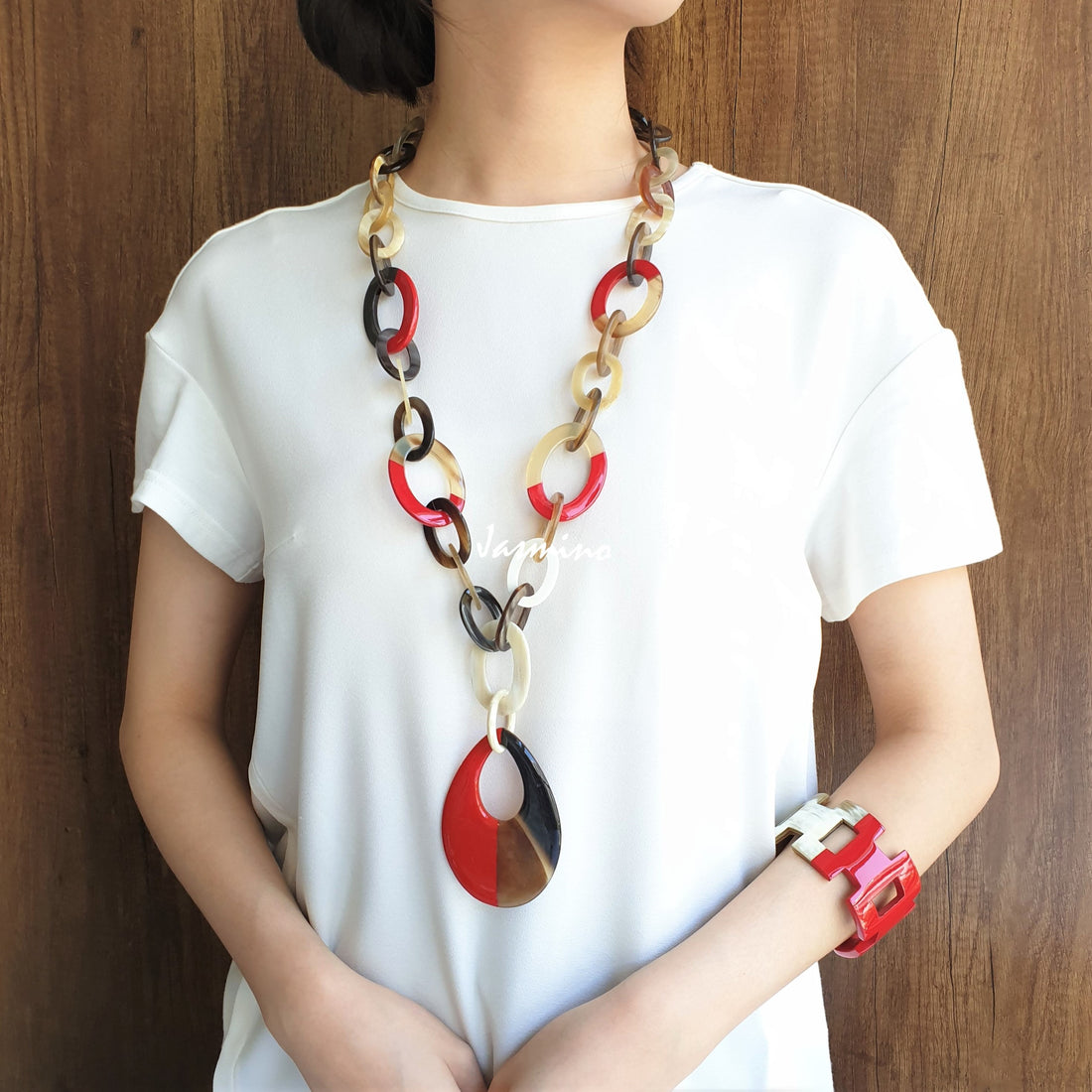 A model is wearing unique handmade Vintage chain link necklace and cuff bracelet in natural buffalo horn for women's gifts