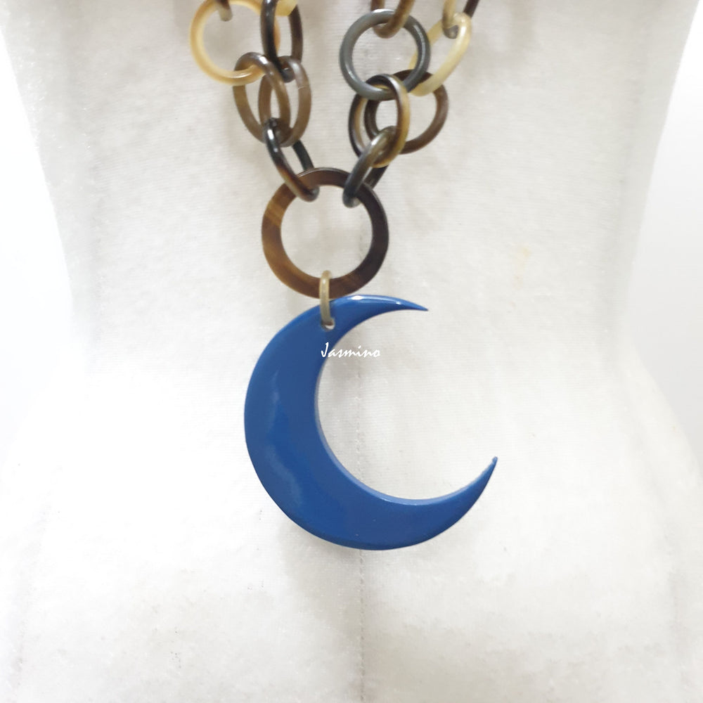 
                  
                     Jasmino unique handmade chain link necklace features a blue crescent moon pendant jewelry accessory in natural buffalo horn for women
                  
                