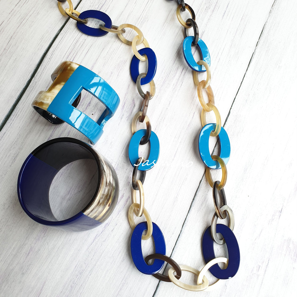 
                  
                    A set of unique handmade Vintage chain link necklace and bracelets features blue, turquoise, and yellow in natural buffalo horn for women's gifts
                  
                