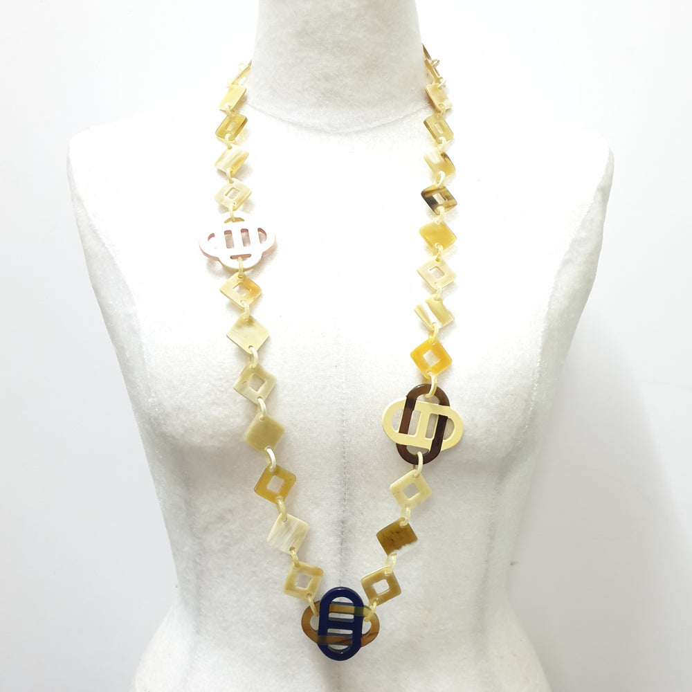 
                  
                    This necklace has several large pieces with different patterns and colors on the light background, unique gift for your friend
                  
                
