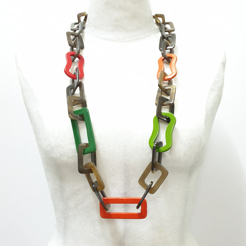 
                  
                    The necklace has some large pieces of different colors on a light background, a unique gift for your friend
                  
                